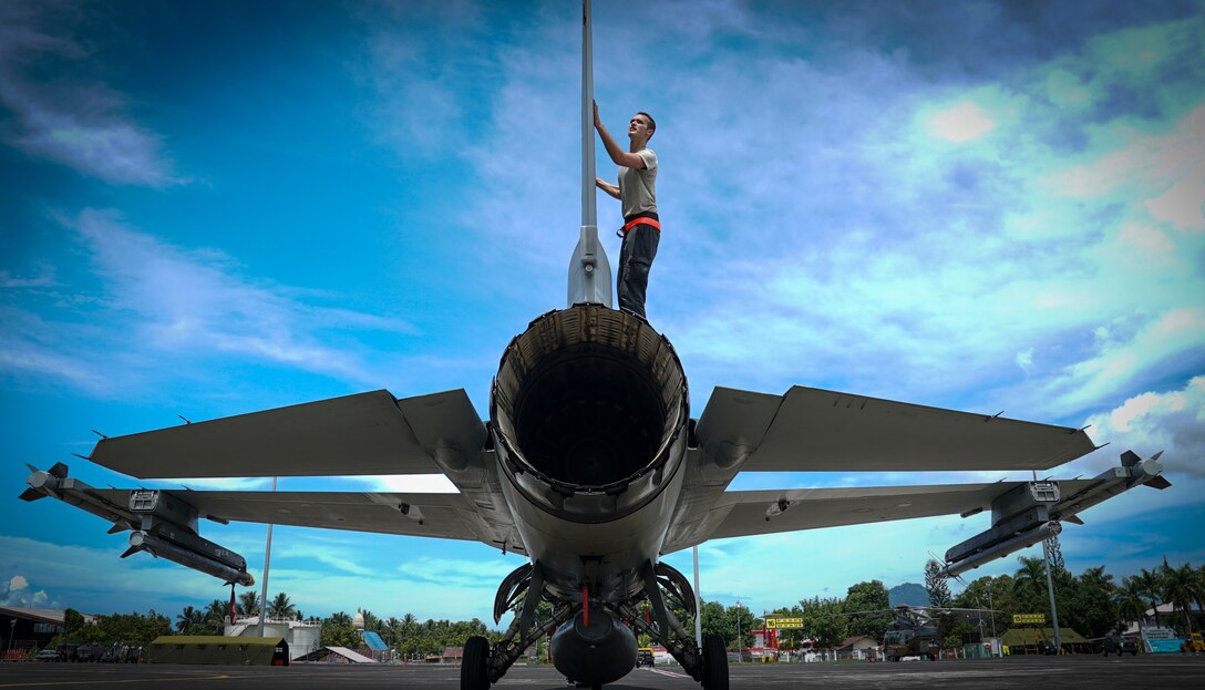 Airman 1st Class Connor Lovan, crew chief assigned to the 13th Aircraft Maintenance Unit, 35th Fighter Wing based out of Misawa Air Base, Japan, conducts a post flight inspection on a F-16C Fighting Falcon during exercise Cope West 2018 at Sam Ratulangi International Airport, Indonesia, March 19, 2018. CW18 is a Pacific Air Forces-sponsored, bilateral, tactical fighter aircraft exercise involving the U.S. and Indonesian air forces and is designed to advance interoperability and build upon already established partnerships between the air forces. (U.S. Air Force photo by Tech. Sgt. Richard Ebensberger)