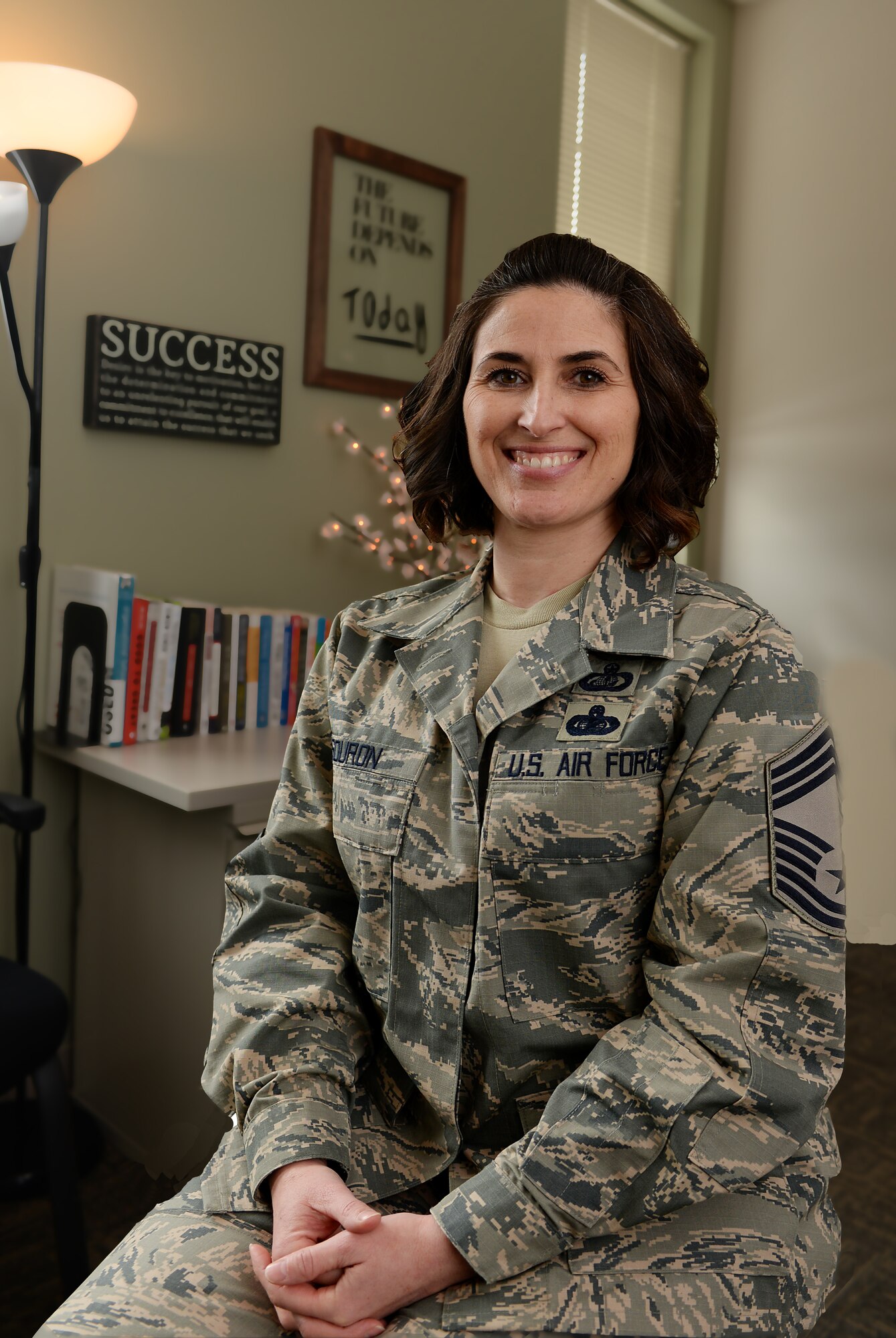 Chief Master Sgt. Laurice A. Souron poses for a photo while in her office at Pease Air National Guard Base. Souron became the eleventh female chief master sergeant in the more than 70 years since the New Hampshire ANG was created.