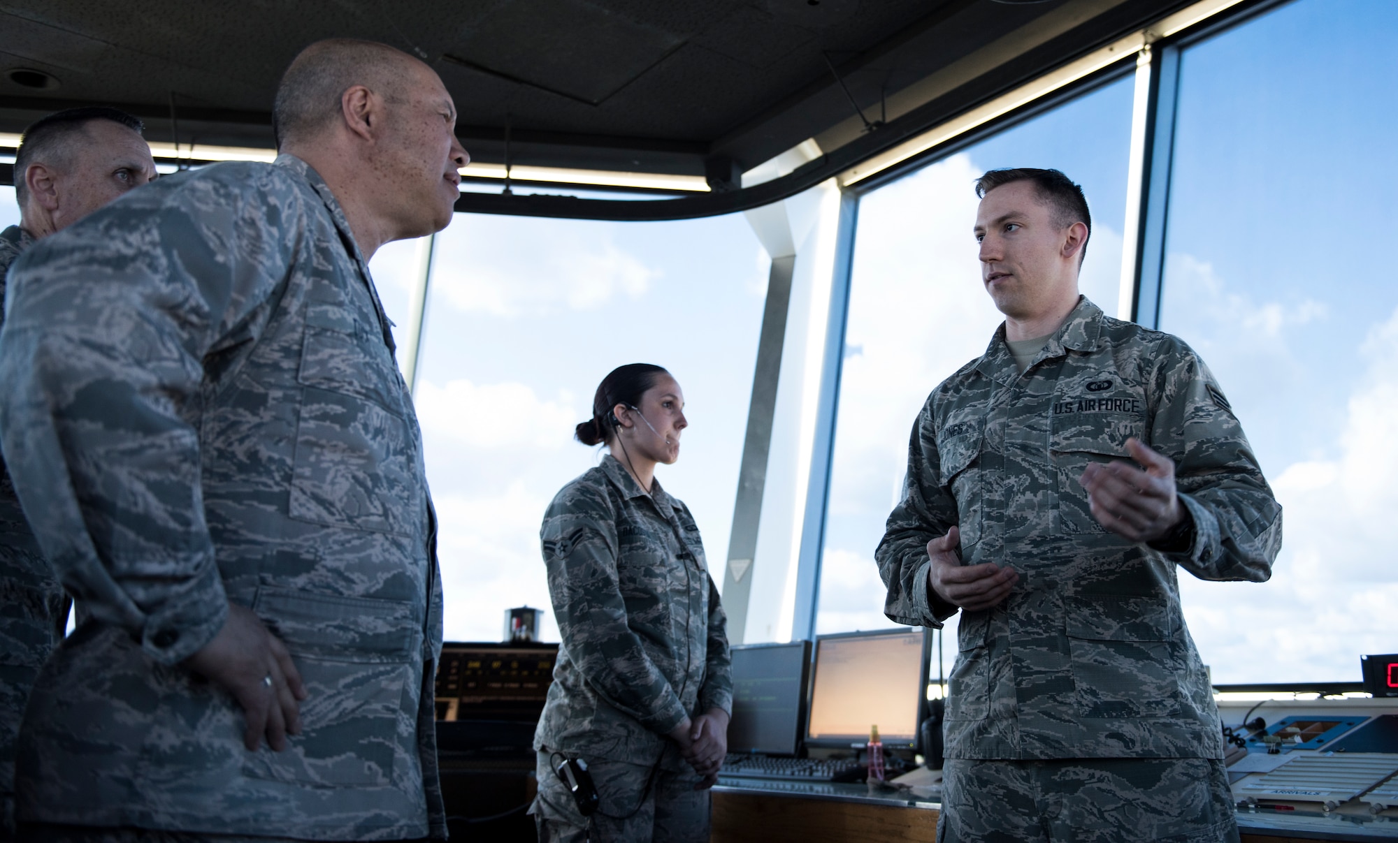 Lt. Gen. GI Tuck, 18th Air Force commander, talks with Senior Airman Brandon Jones, 92nd Operations Support Squadron air traffic controller, about air tower operations March 19, 2018, at Fairchild Air Force Base, Washington. Tuck and his team visited Airmen in their work environments to discuss their goals, priorities and expectations for the 18th AF team. . (U.S. Air Force photo/Senior Airman Sean Campbell)