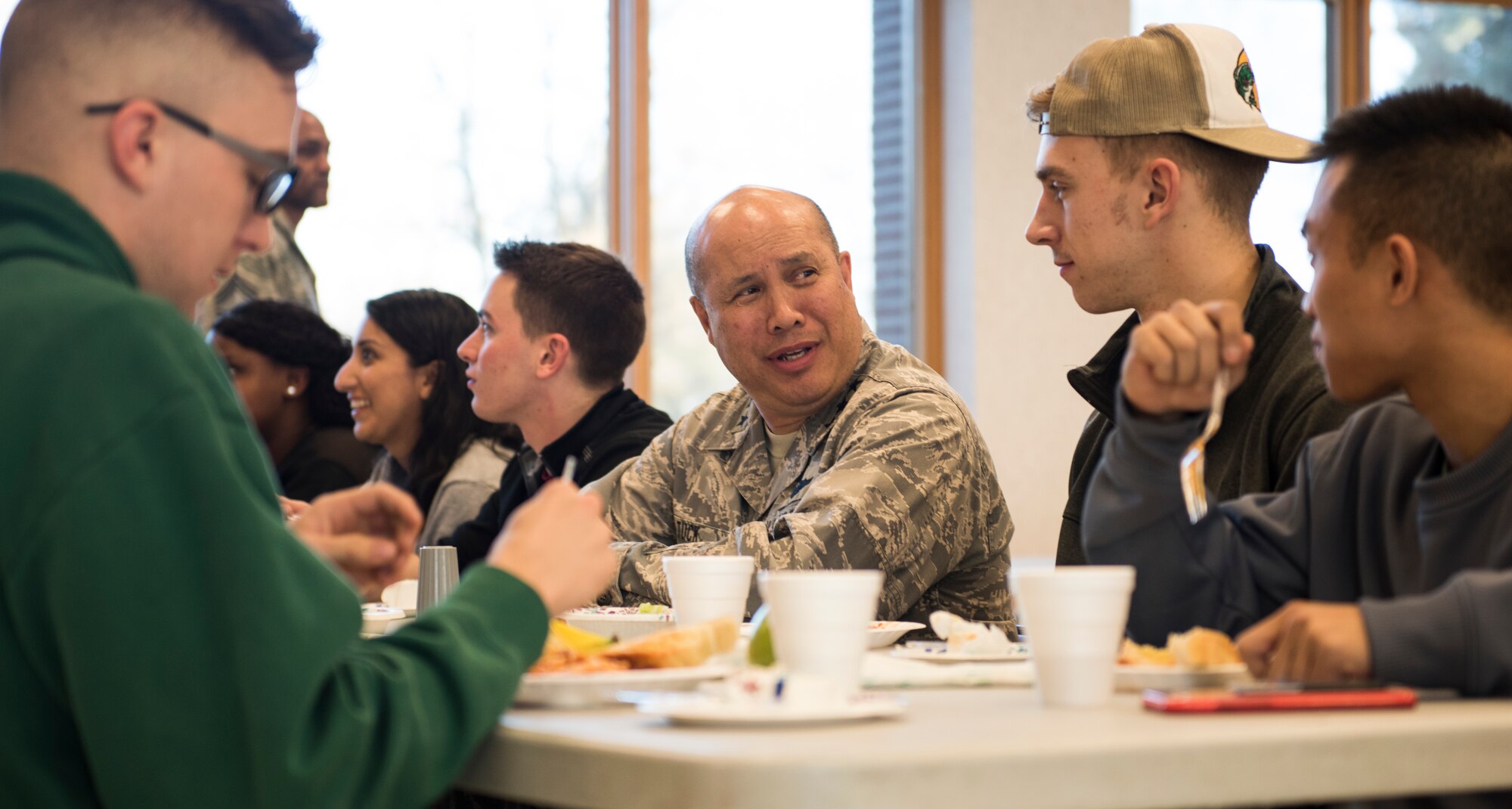 Lt. Gen. GI Tuck, 18th Air Force commander, talks with Airmen during a spaghetti dinner held at the base chapel March 20, 2018, at Fairchild Air Force Base, Washington. Tuck said his team was impressed with Fairchild’s innovations and encouraged Airmen to continue to speak up about ways to execute the mission better. (U.S. Air Force photo/Senior Airman Sean Campbell)