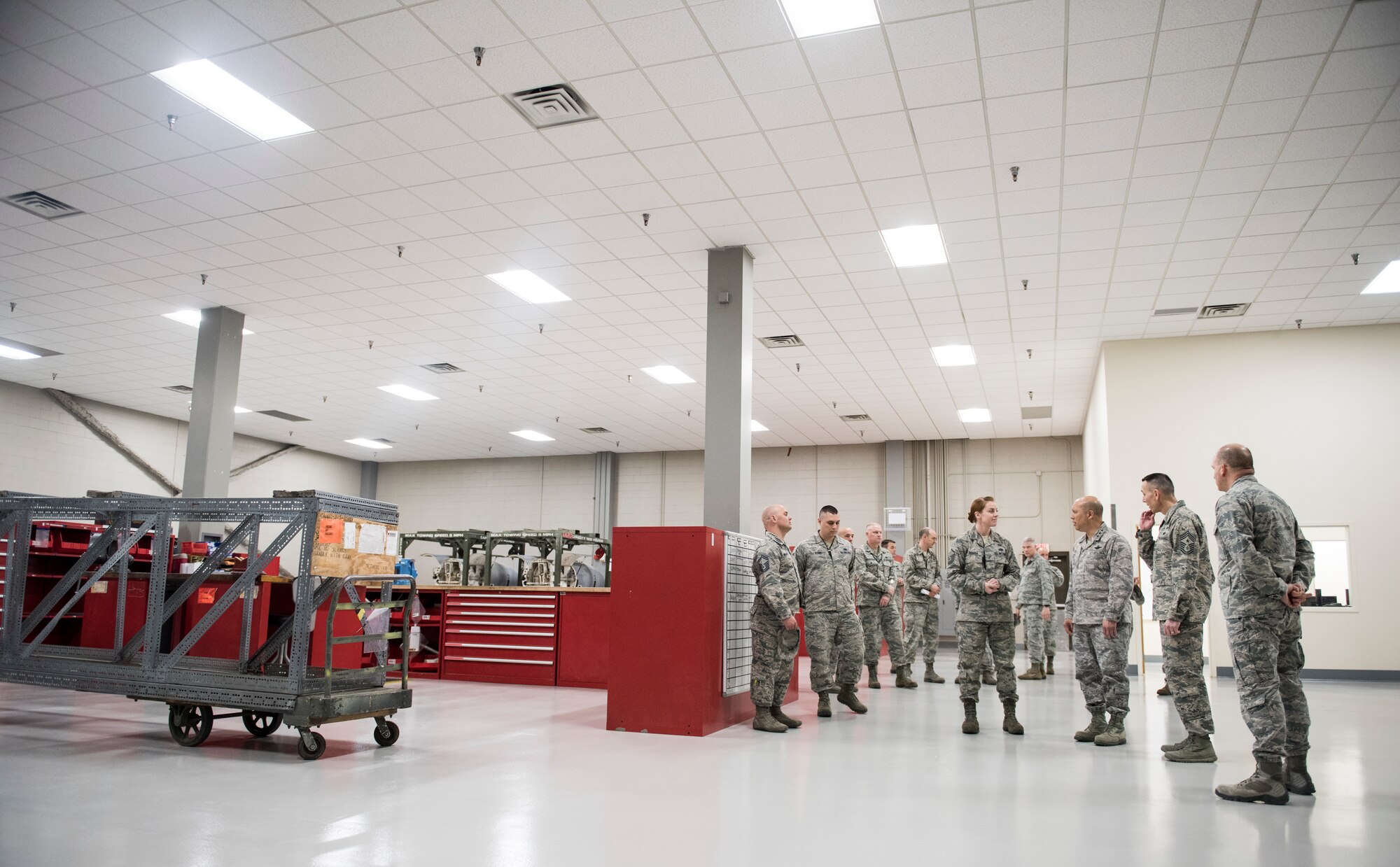 Lt. Gen. GI Tuck, 18th Air Force commander, and Chief Master Sgt. Todd Petzel, 18th AF command chief, view a new hydraulics shop during a mission immersion March 20, 2018, at Fairchild Air Force Base, Washington. The tour familiarized 18th AF leadership with the Fairchild mission and the Airmen who make it happen.  (U.S. Air Force photo/Senior Airman Sean Campbell)