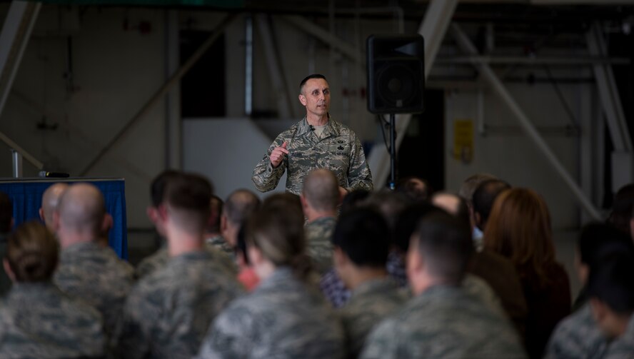Chief Master Sgt. Todd Petzel, 18th AF command chief, talks to Team Fairchild during a base all-call March 21, 2018, at Fairchild Air Force Base, Washington. During the all-call, Petzel emphasized the importance of every Airman and the work they do to enable Rapid Global Mobility. (U.S. Air Force photo/Senior Airman Sean Campbell)