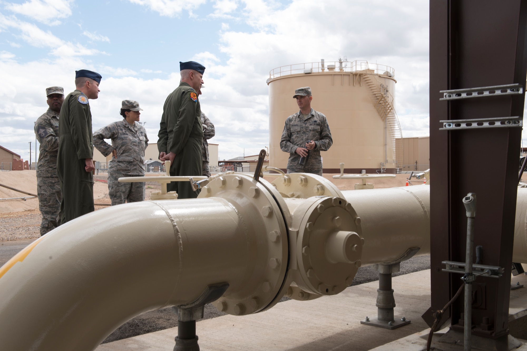 Tech. Sgt. Donald Grunden, 56th Logistics Readiness Squadron Fuels Management operator, briefs members of Luke’s command team on the new fuel pump house following its ribbon-cutting ceremony at Luke Air Force Base, Ariz., March 15, 2018. The pump house, along with a simultaneously developed fill stand, will allow fuel trucks servicing jets to resupply directly from the flight line instead of having to drive to external pumps. (U.S. Air Force photo by Senior Airman Ridge Shan)