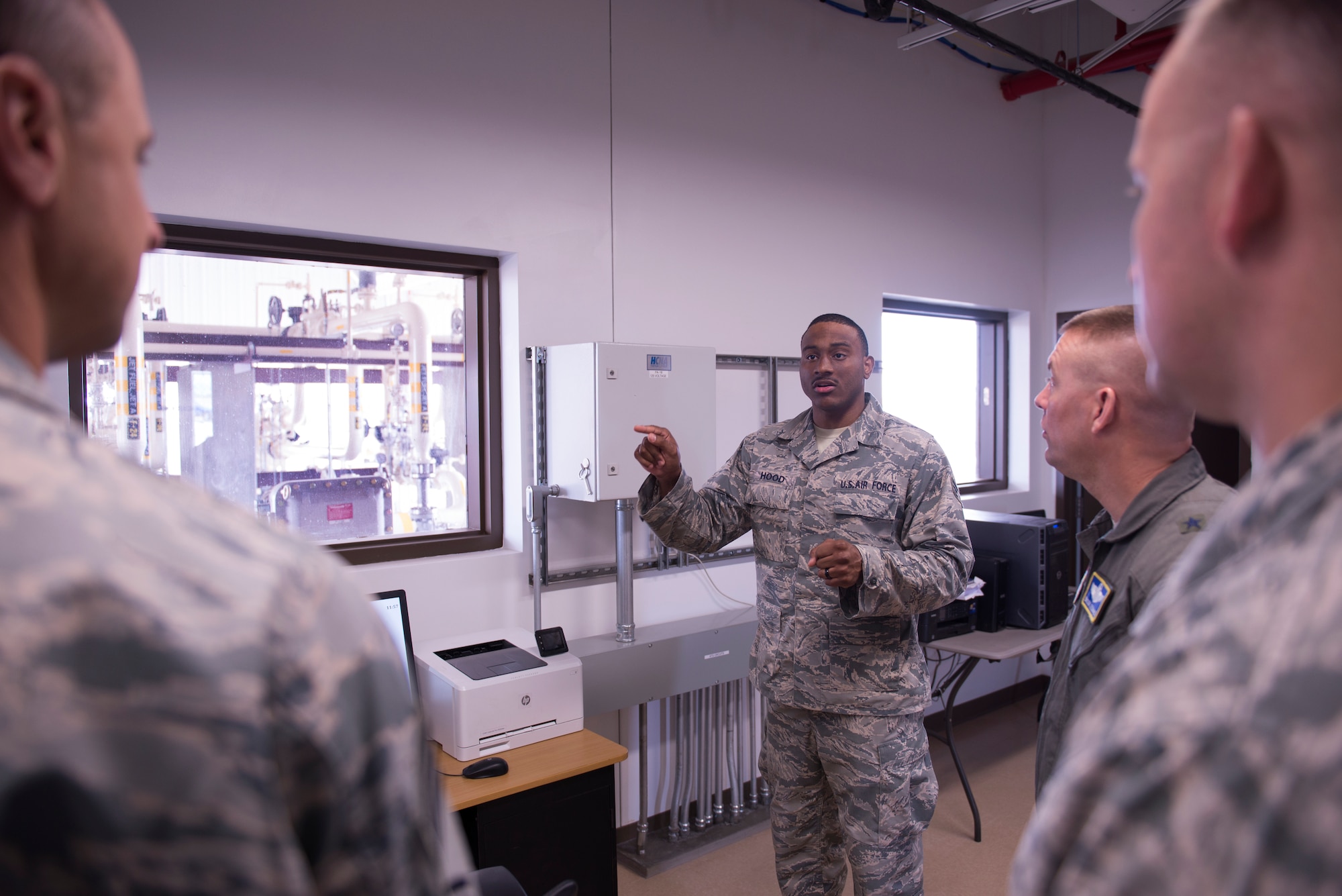 Senior Airman Kyle Hood, 56th Logistics Readiness Squadron Fuels Knowledge Operations administrator, explains system processes and control functions of the new fuel pump house to members of Luke’s command team at Luke Air Force Base, Ariz. March 15, 2018. The pump house will pump fuel from offsite sources into on-base tanks and then distribute fuel to various locations, including a new fill stand on the flight line. (U.S. Air Force photo by Senior Airman Ridge Shan)