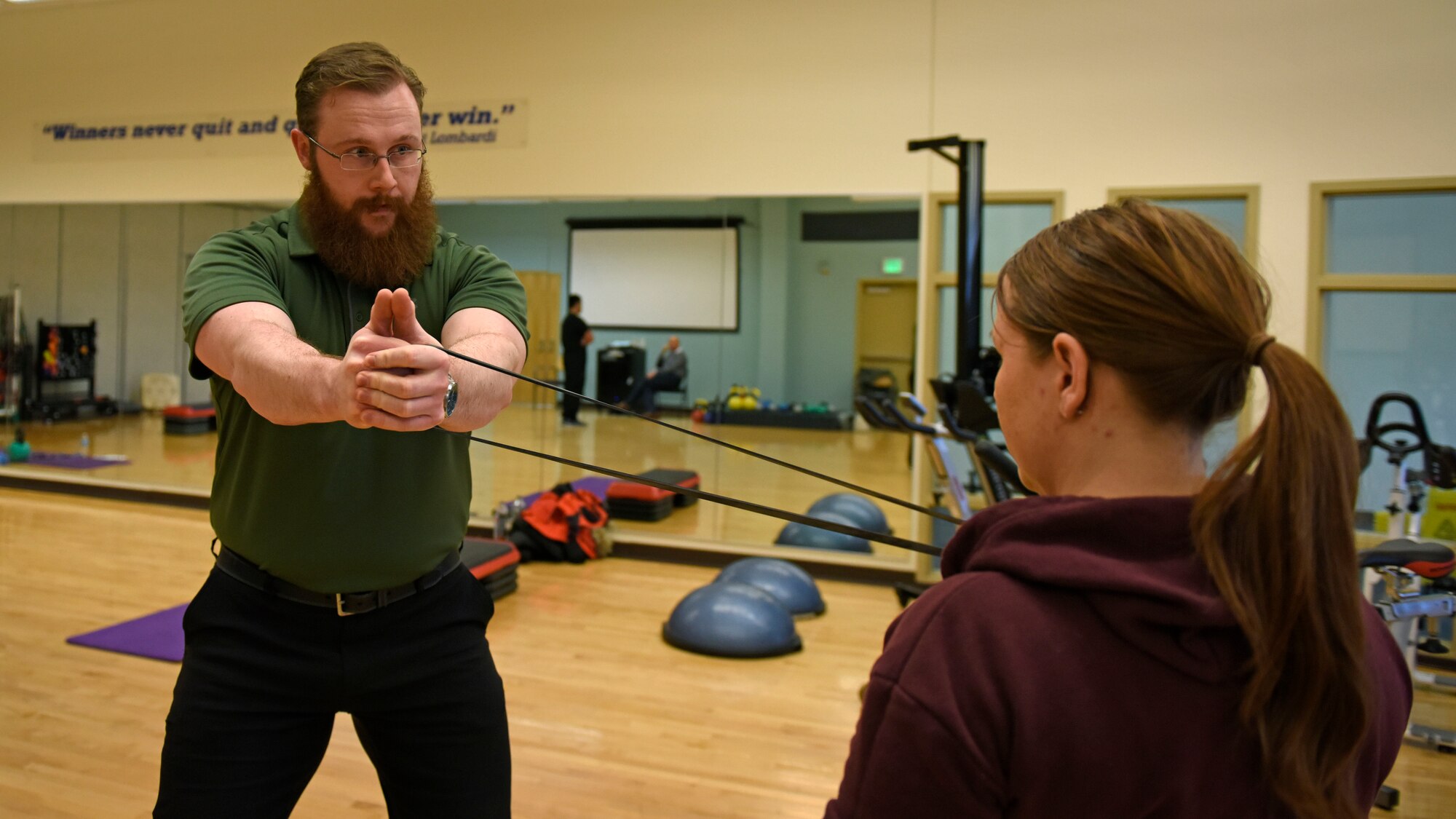 Justin Clifford, 92nd Medical Operations Squadron physical therapist, demonstrates resistance band training to Staff Sgt. Jamie Skrainka, 92nd Maintenance Squadron Human Performance Cell patient, at Fairchild Air Force Base, Washington, Feb. 26, 2018. Starting in October, all military members who have been non-deployable for more than 12 consecutive months, for any reason, will be processed for administrative separation. The HPC program’s objective is to reduce the number of non-deployable service members and improve personnel readiness across the force. (U.S. Air Force photo/Airman 1st Class Jesenia Landaverde)