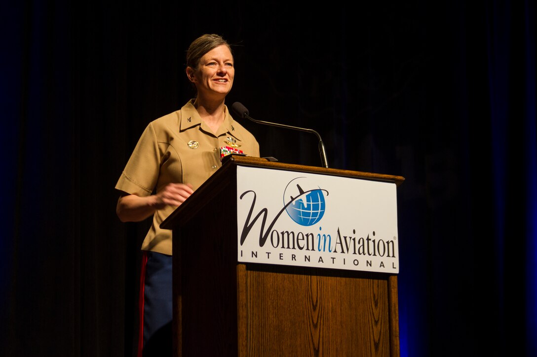 Col. Alison Thompson tells her Marine aviation story and stresses the importance of females in the Marine Corps at the Connect, Engage and Inspire general session during Women in Aviation, International's (WAI) 29th Annual Symposium in Reno, Nevada, March 24. Marines attended WAI to generate awareness for career opportunities in the Marine Corps while engaging with highly-qualified individuals and key influencers. Thompson was the first female Marine to command a flight squadron in a combat zone. (U.S. Marine Corps photo by Lance Cpl. Naomi Marcom)