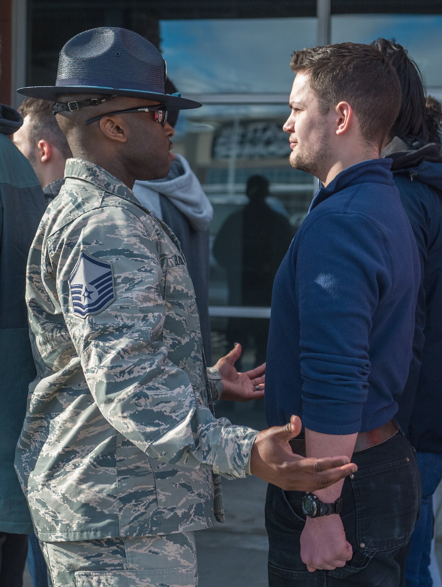 U.S. Air Force Master Sgt. Alonso Blackman, 673d Medical Support Squadron transfusion services section chief and a former basic training military training instructor, gives future Airmen a taste of basic military training in Anchorage, Alaska, March 13, 2018. Blackman taught the recruits the basics of drill, military bearing, dress and appearance, and reporting statements.