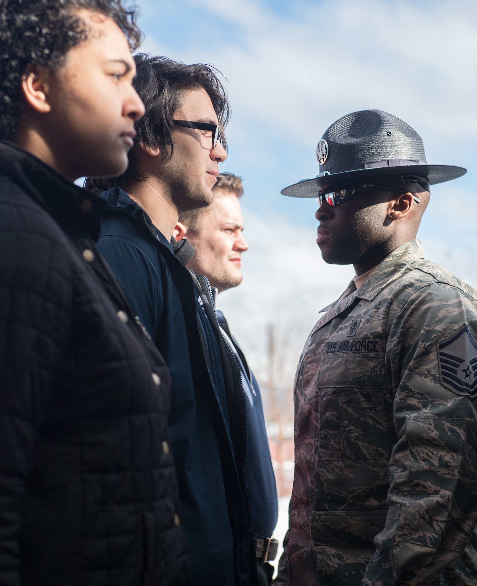 U.S. Air Force Master Sgt. Alonso Blackman, 673d Medical Support Squadron transfusion services section chief and a former basic training military training instructor, gives future Airmen a taste of basic military training in Anchorage, Alaska, March 13, 2018. Blackman taught the recruits the basics of drill, military bearing, dress and appearance, and reporting statements.