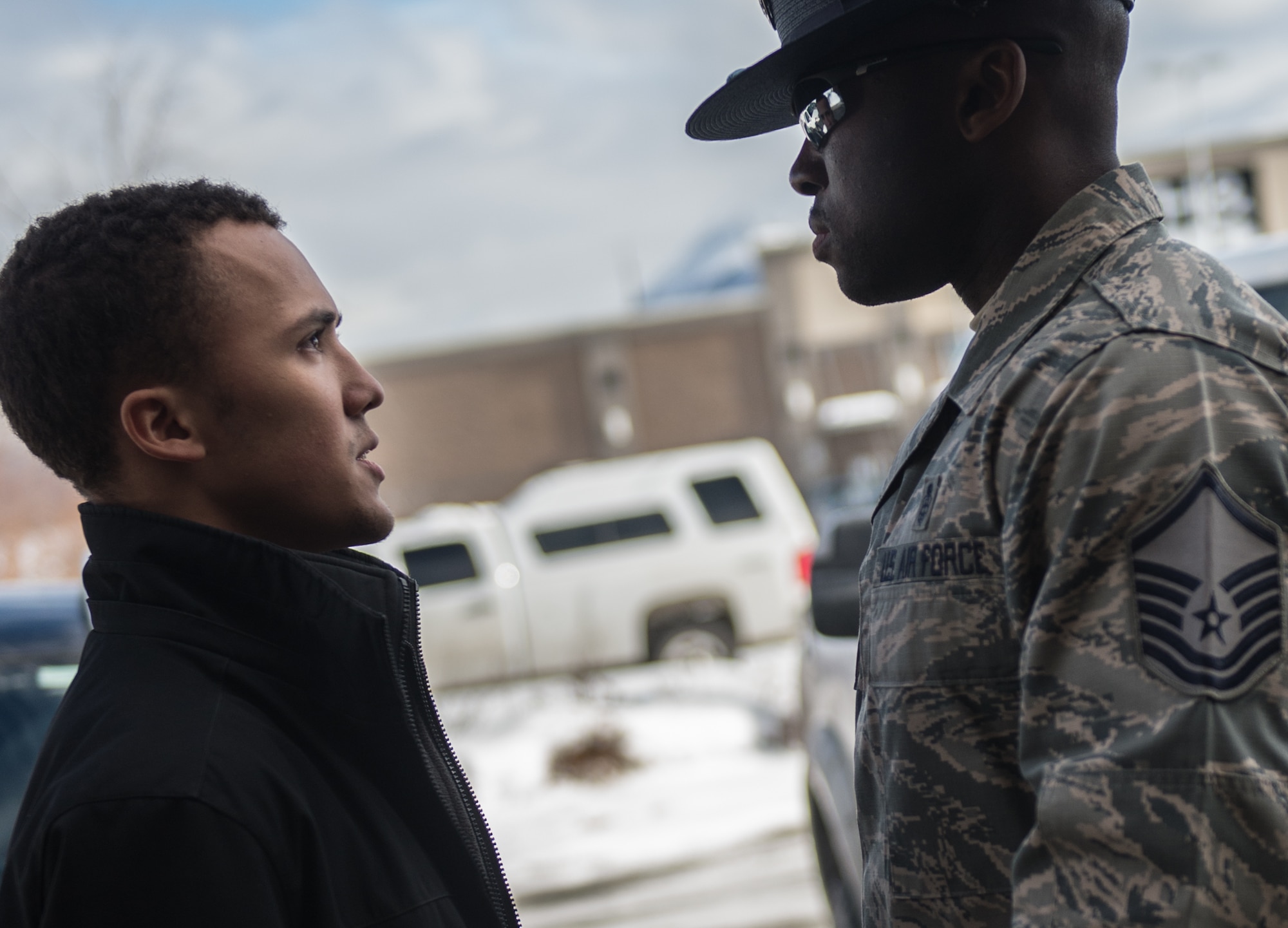 U.S. Air Force Master Sgt. Alonso Blackman, 673d Medical Support Squadron transfusion services section chief and a former basic training military training instructor, gives a future Airman a taste of basic military training in Anchorage, Alaska, March 13, 2018. Blackman taught the recruits the basics of drill, military bearing, dress and appearance, and reporting statements.