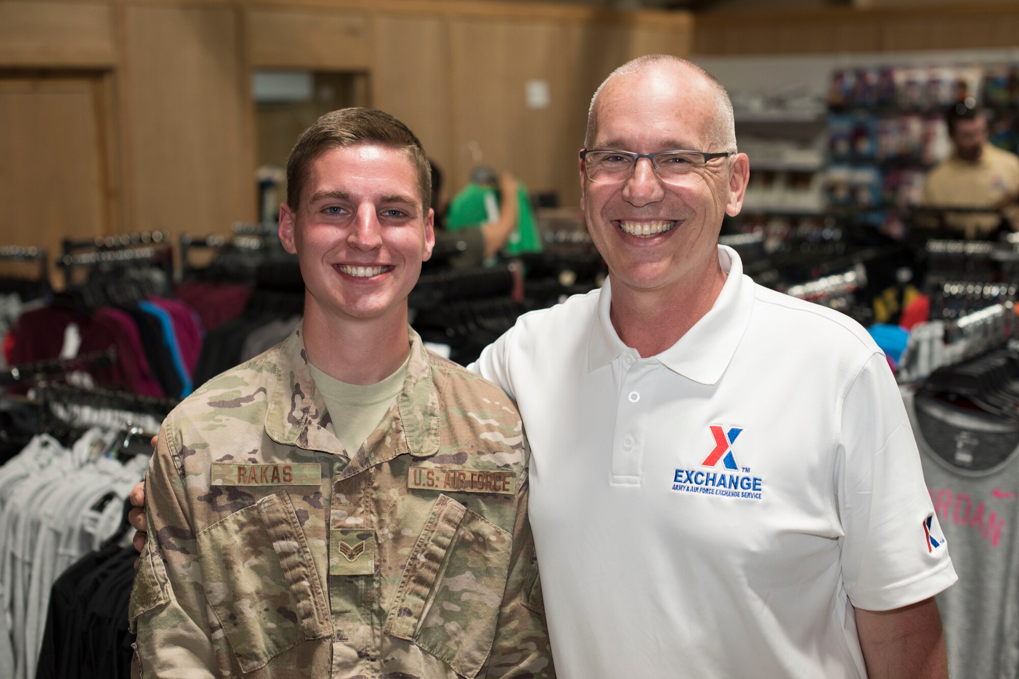 Airman 1st Class Alexander Rakas (left), 332nd Expeditionary Maintenance Squadron munition system specialist, and Gino Rakas, Army and Air Force Exchange Service services business program specialist for Europe, Southwest Asia and Africa, pose for a photo at an undisclosed location in Southwest Asia March 21, 2018.