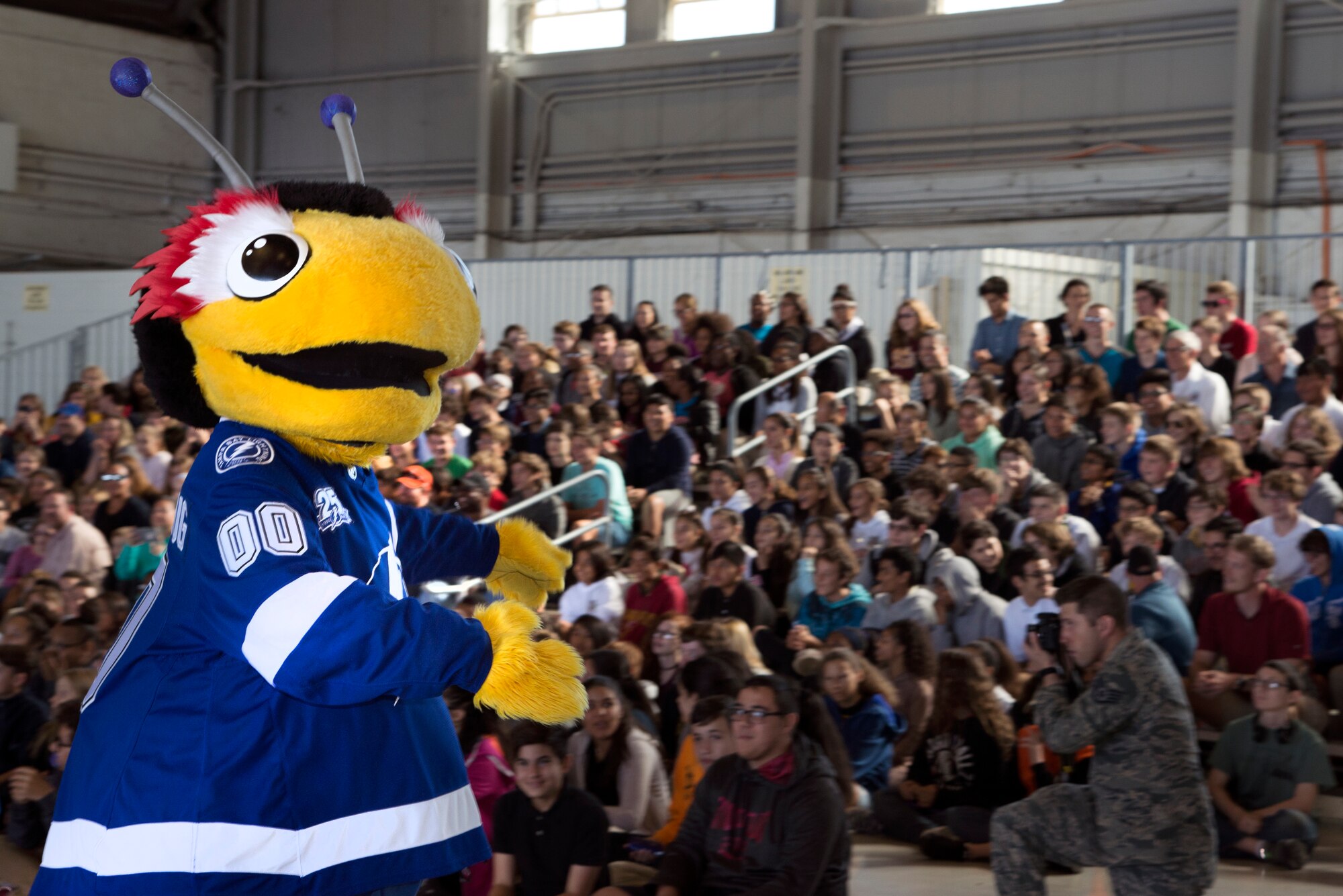 The Tampa Bay Lightning mascot, Thunder Bug, pumps up the crowd during the Science, Technology, Engineering, Arts and Math (STEAM) Day at MacDill Air Force Base, Fla., March 21, 2018.
