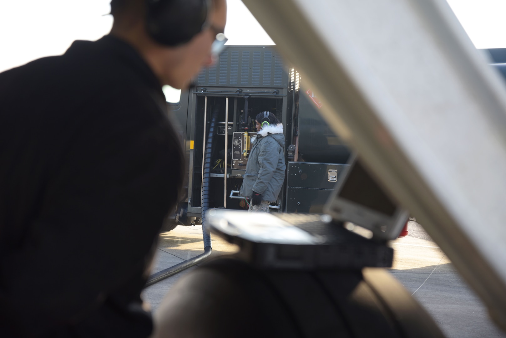 U.S Air Force Airman 1st Class Aaliyah Tucker, 100th Logistics Readiness Squadron petroleum, oil and lubricant fuels distributor pumps an R-11 fuel truck at RAF Mildenhall, England, Jan. 21, 2018. The 100th LRS has both R-11 and C-300 fuel trucks, both of which hold thousands of gallons of fuel for both the aircraft and various equipment around the base. (U.S. Air Force photo by Airman 1st Class Alexandria Lee)