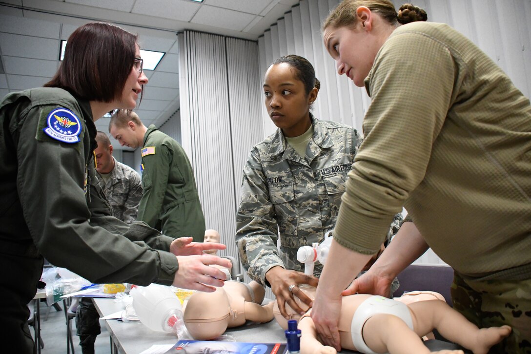 At left, Staff Sgt. April White, 932nd Airlift Wing Aeromedical Evacuation Squadron medical technician, helps explain the methods for taking care of babies and small children during a refresher class held March 6, 2018, at the 932nd Medical Group, Scott Air Force Base, Ill.  With enthusiasm and professionalism, she was presented with a Chief's coin in the past by the Air Force Reserve Command, Command Chief, Chief Master Sgt. Ericka Kelly for being a standout Airman within the AES and for her self improvements and positive attitude.  (U.S. Air Force photo by Lt. Col. Stan Paregien)