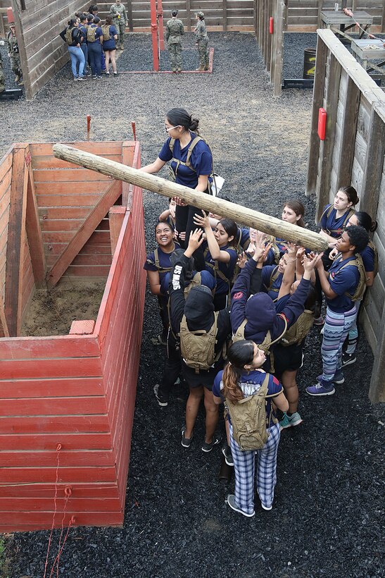 Female poolees of Marine Corps Recruiting Station Orange County maneuver through the Leadership Reaction Course during an annual function at Marine Corps Base Camp Pendleton, Mar. 10, 2018. This function brought together young women from across southern California to experience aspects of recruit training in order to provide insight and understanding as to what they'll endure at the depot for 13 weeks. Roughly nine percent of women serve in the United States Marine Corps, the smallest percentage of females in any branch of service. This makes it very important to bring these young women together and learn about specific aspects of life as a Marine, such as hair, hygiene, physical fitness and culture.