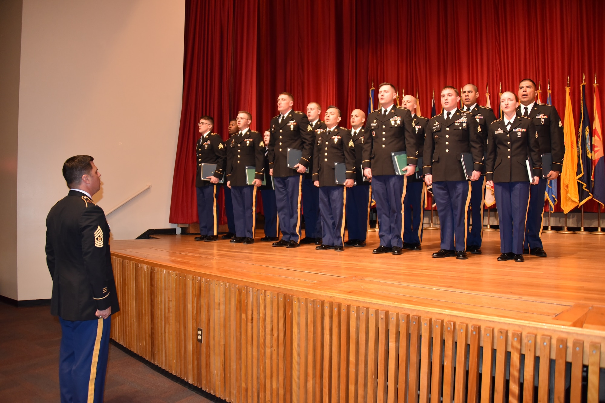 An induction ceremony by the U.S. Army Space and Missile Defense Command/Army Forces Strategic Command’s 1st Space Brigade was hosted to induct 14 new Soldiers into the noncommissioned officer corps, March 9, 2018 at Fort Carson, Colo. This induction ceremony is a traditional event to celebrate the newly promoted sergeants. (Photo by USASMDC/ARSTRAT Public Affairs)