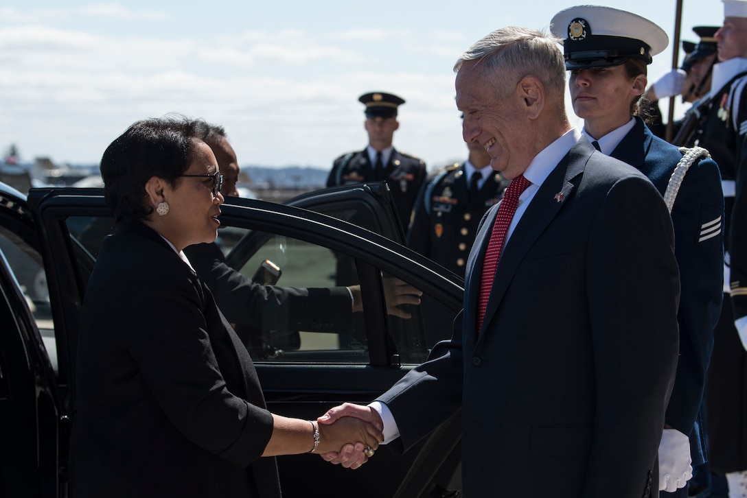 Defense Secretary James N. Mattis shakes hands with Indonesian Foreign Affairs Minister Retno Marsudi.