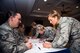 Col. Jennifer Short, 23d Wing commander, signs a 2018 Air Force Assistance Fund donation packet, March 26, at Moody Air Force Base, Ga. The AFAF helps current and fellow Airmen in need to overcome financial hardships. Maximum participation from the Flying Tigers will help reach their goal of collecting $70,469. (U.S. Air Force photo by Senior Airman Greg Nash)