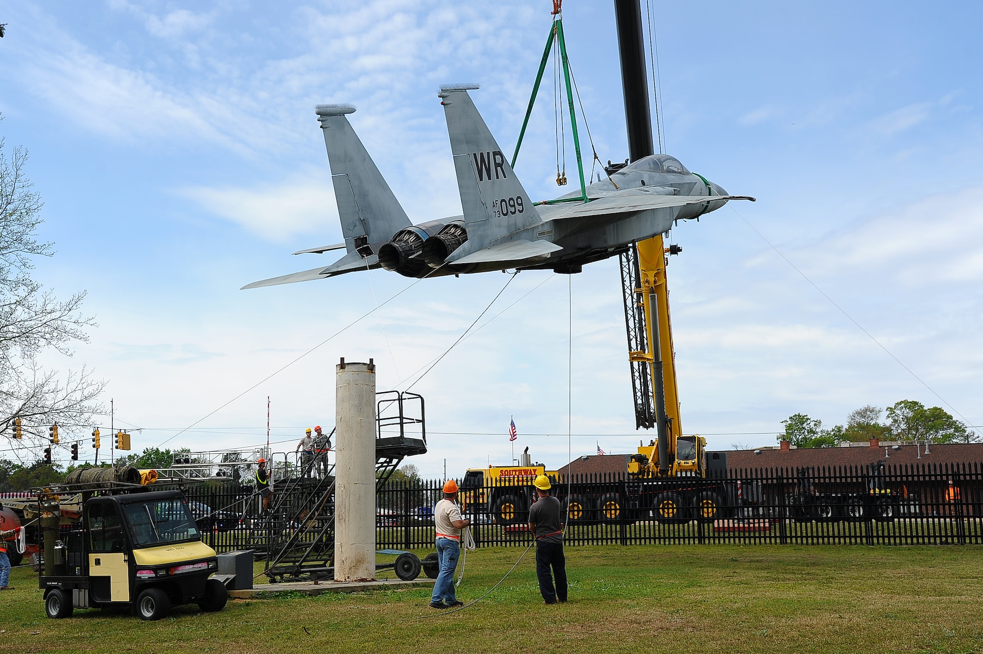 The 402nd Aircraft Maintenance Group removes the F-15 display and transports to the paint shop.