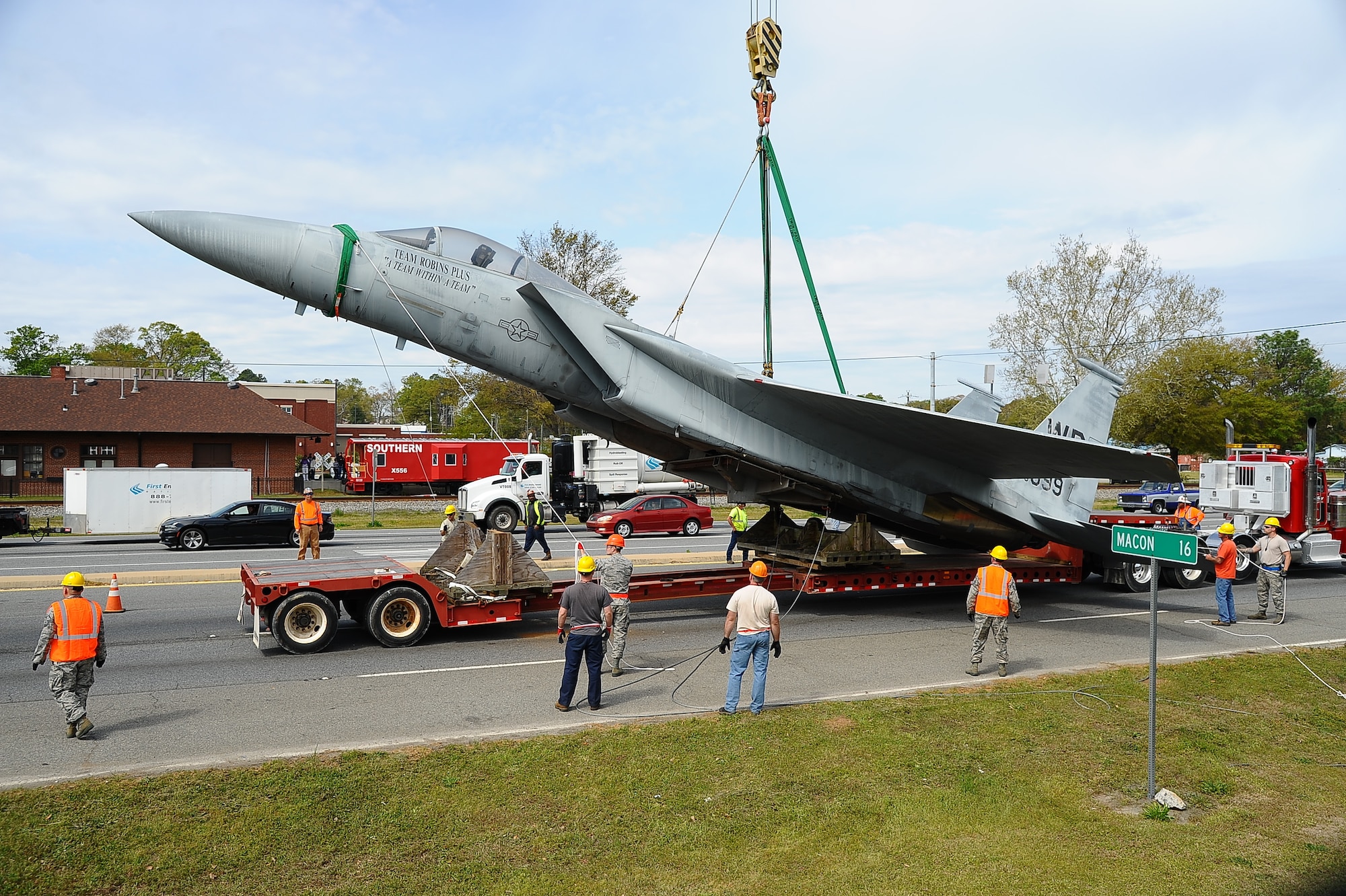 The 402nd Aircraft Maintenance Group removes the F-15 display and transports to the paint shop.