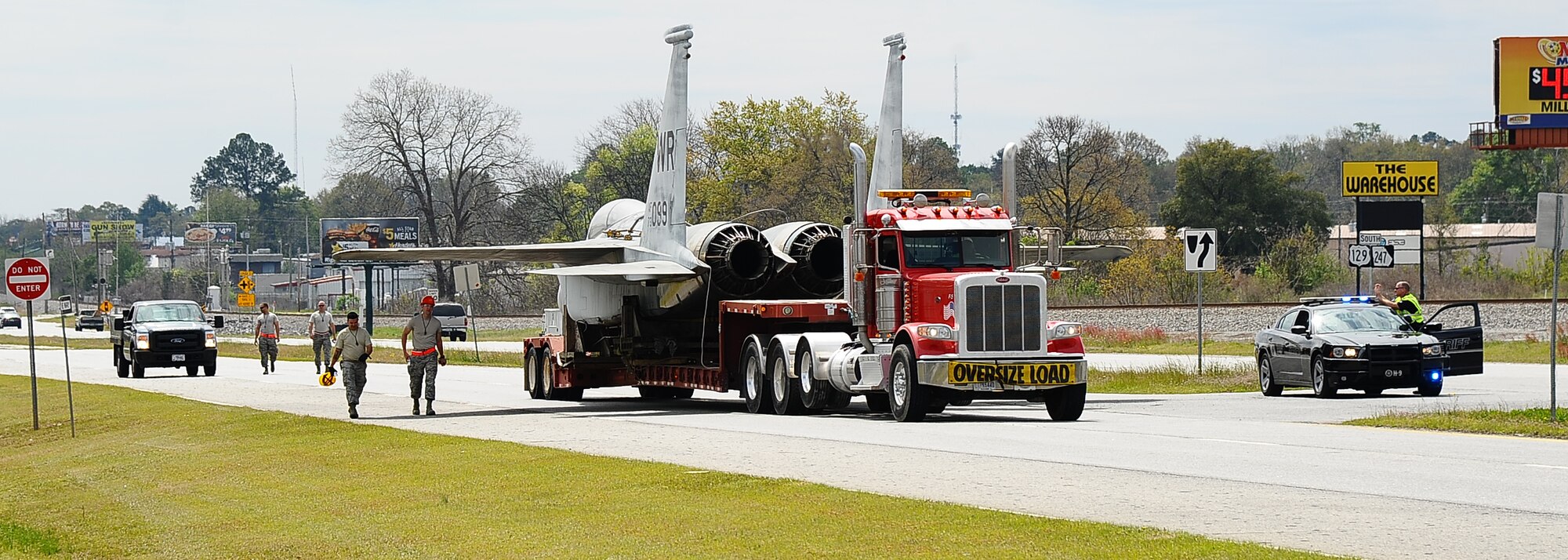 The 402nd Aircraft Maintenance Group removes the F-15 display and transports to the paint shop.