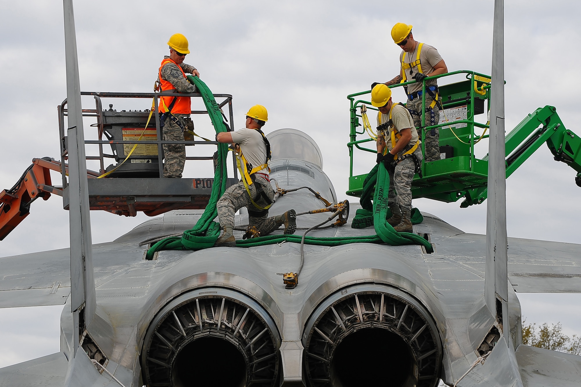 The 402nd Aircraft Maintenance Group removes the F-15 display and transports to the paint shop.