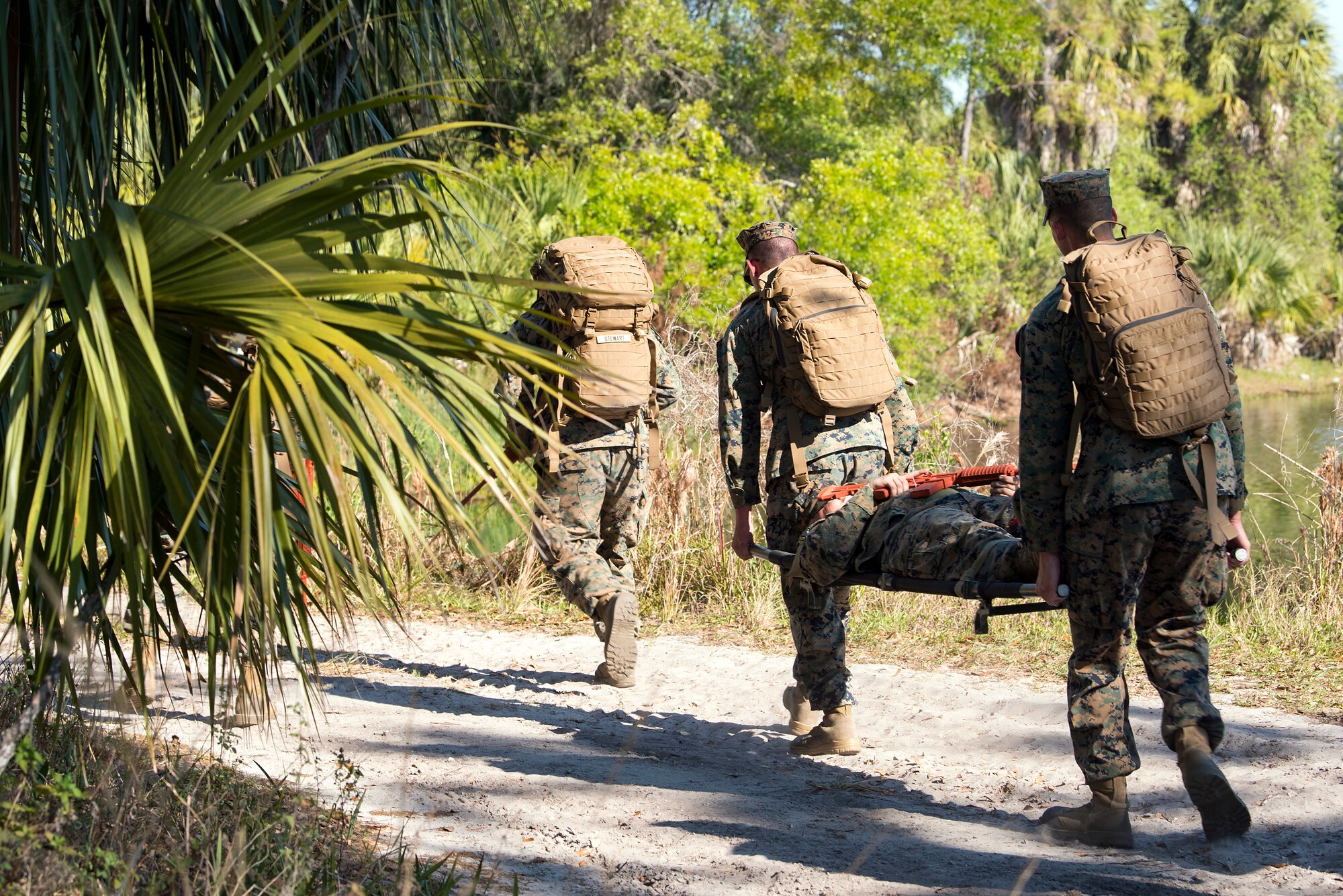 U.S. Marines carry a simulated victim during a U.S. Marine Corps Forces Central Command noncommissioned officer field exercise at MacDill Air Force Base, Fla., March 14-15, 2018. As part of the exercise, Marines participated in various practical scenarios such as land navigation, patrolling and medical emergencies.