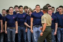 Individuals from the Des Moines area who have recently enlisted in the Marine Corps attempt to follow commands from Staff Sgt. John Leech, drill instructor, 1st Recruit Training Regiment, during a Drill Instructor Family Night at Events Center West in West Des Moines, Iowa, March 23, 2018. Marine Corps Recruiting Command hosts the family nights to better prepare both parent and enlistee prior to attending Marine Corps Recruit Training. (Official U.S. Marine Corps photo by Sgt. Levi Schultz)