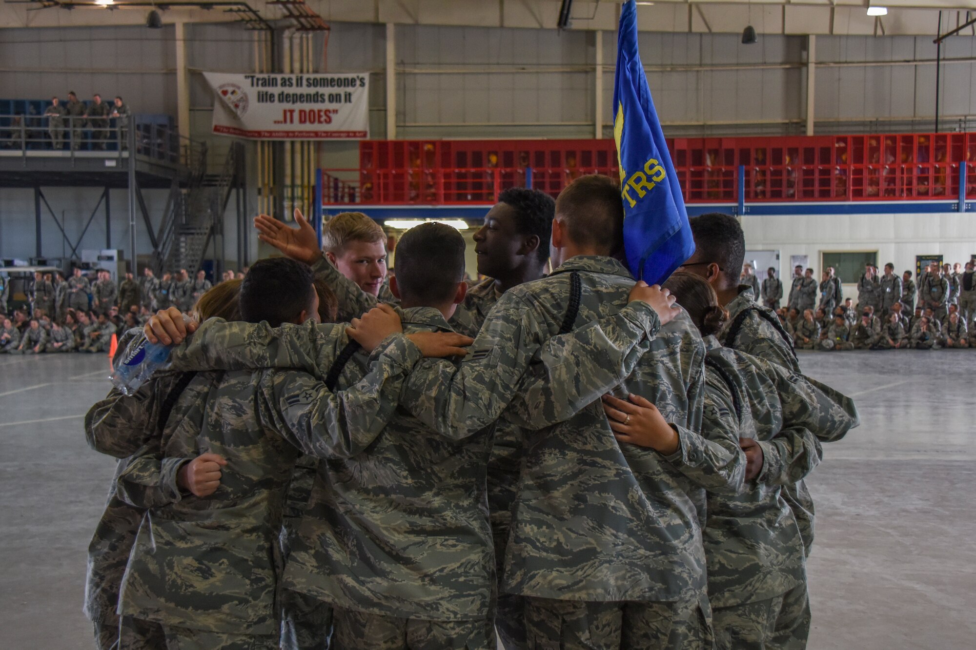 The 315th Training Squadron team gathers together before competing in the quarterly drill competition at the Louis F. Garland Department of Defense Fire Academy on Goodfellow Air Force Base, Texas, March 23, 2018. While there was a joint group consisting of trainees from the 316th TRS, 315th Training Squadron and the 312th Training Squadron competing for the exhibition drill, each squadron could compete against each other during the regulation drill portion of the event.
 (U.S. Air Force photo by Airman 1st Class Zachary Chapman/Released)