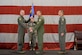 Col. David Smith, 419th Fighter Wing commander, passes the group flag to Col. Sean Carpenter, the new commander of the 419th Operations Group