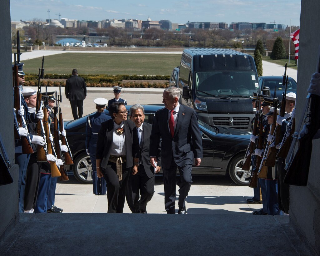 Defense Secretary James N. Mattis, right, and Indonesian Foreign Minister Retno Marsudi enter the Pentagon.
