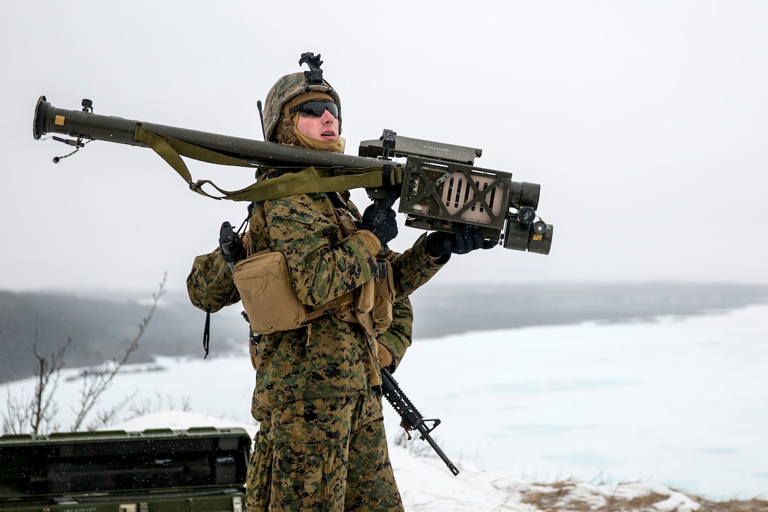 A Marine prepares to fire a stinger training simulator.