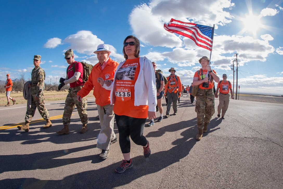 Skardon walks with service members and supporters.