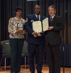 Shereda Riley, left, wife of Senior Master Sgt. Paul Riley, center, the 35th Maintenance Squadron armament flight chief, and Retired General Yoshiyuki Watanabe, right, the Japan-American Air Force Goodwill Association vice president, pose for a photo at Misawa Air Base, Japan, March 20, 2018. Riley earned the recognition for his efforts in leading the 35th Fighter Wing’s bilateral relations team. (U.S. Air Force photo by Airman 1st Class Collette Brooks)