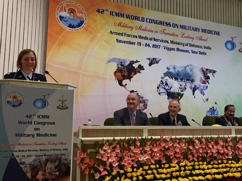 Lt. Col. Elizabeth Erickson, a U.S. Air Force physician, speaks at the International Committee of Military Medicine along with Dr. J. Christopher Daniel and Dr. David Smith from the U.S. delegation in New Delhi, India, November 2017. Erickson spoke on research she had done relating to military medicine, and was the only female among the 9-person U.S. delegation. (Courtesy photo)