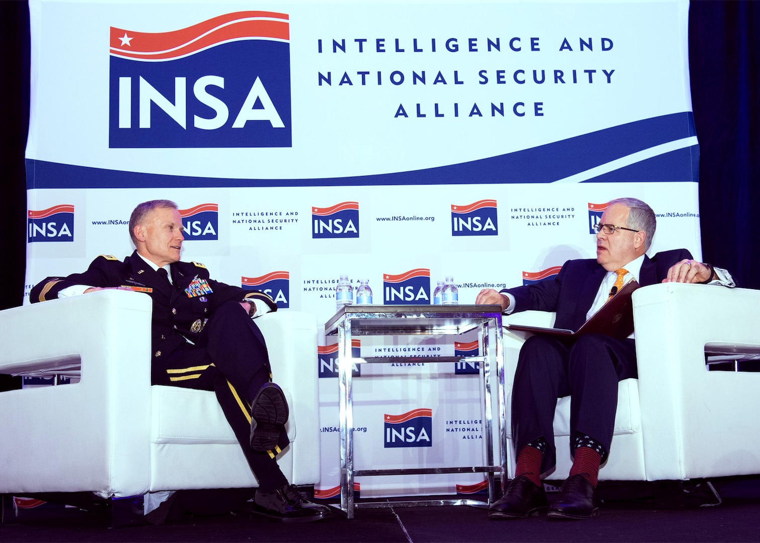 Defense Intelligence Agency (DIA) Director, LTG Robert P. Ashley and former acting DIA director David R. Shedd confer during the Intelligence and National Security Alliance (INSA) Leadership Dinner at the Renaissance Arlington Capital View Hotel, Arlington, VA, Thursday, March 8, 2018. Photo courtesy of INSA, © 2018 Herman Farrer Photography.