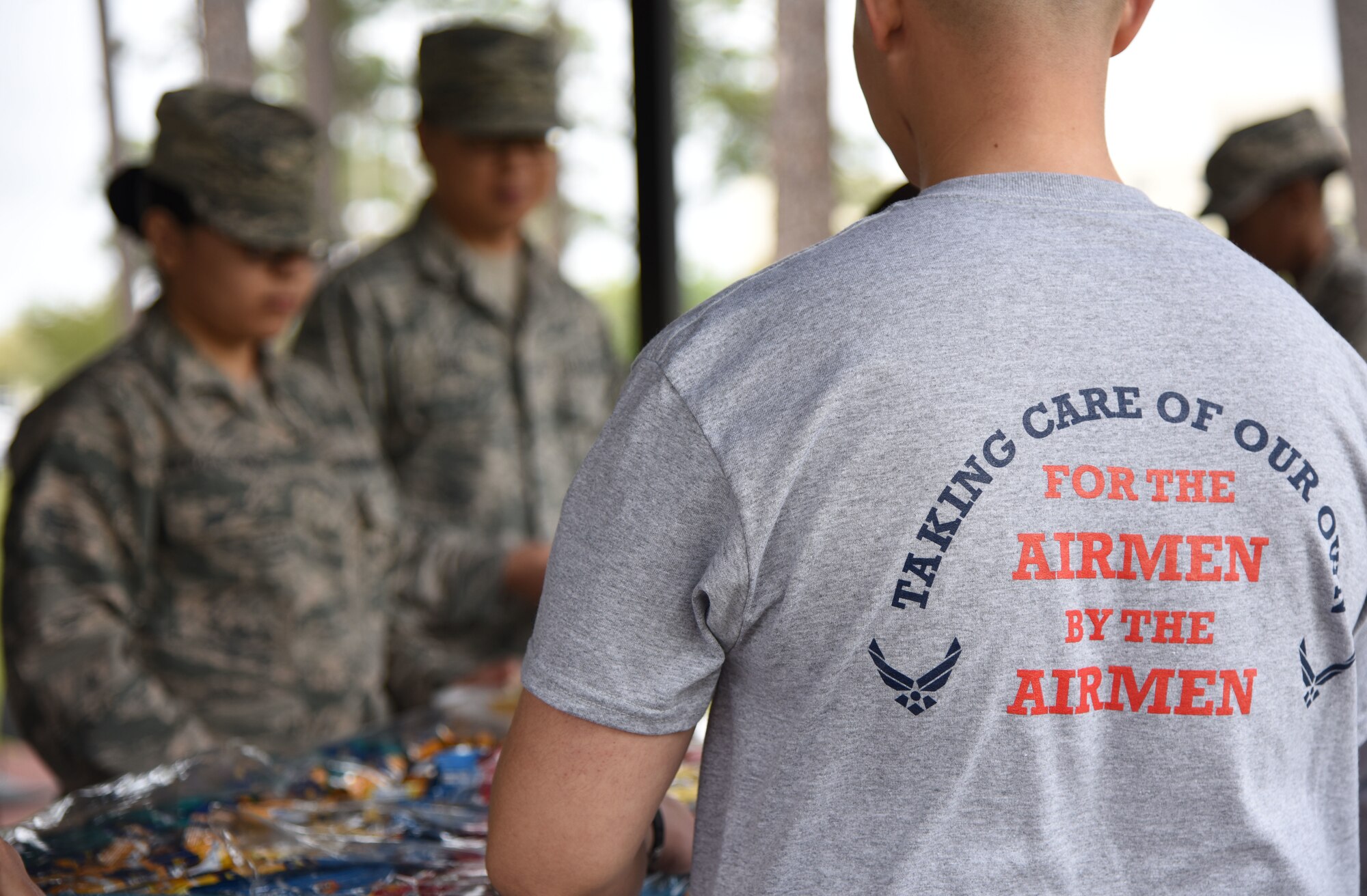 U.S. Air Force Master Sgt. Gerald Casilla, 81st Medical Support Squadron personnel administration flight chief, wears an Air Force Assistance Fund t-shirt during the AFAF burger burn at the Crotwell Track March 26, 2018, on Keesler Air Force Base, Mississippi. The AFAF is an annual effort to raise funds for charitable affiliates that provide support to our Air Force family in need. (U.S. Air Force photo by Kemberly Groue)