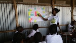 A child from Hawassa, Ethiopia, presents her group's results from the human-centered design process they were using March 10, 2018, to determine the ultimate soccer academy they hope to build. Yared Amanuel, originally from Ethiopia and an engineer from Naval Surface Warfare Center, Carderock Division, taught the children how to use human-centered design to help them solve problems while he was there on personal travel in March.