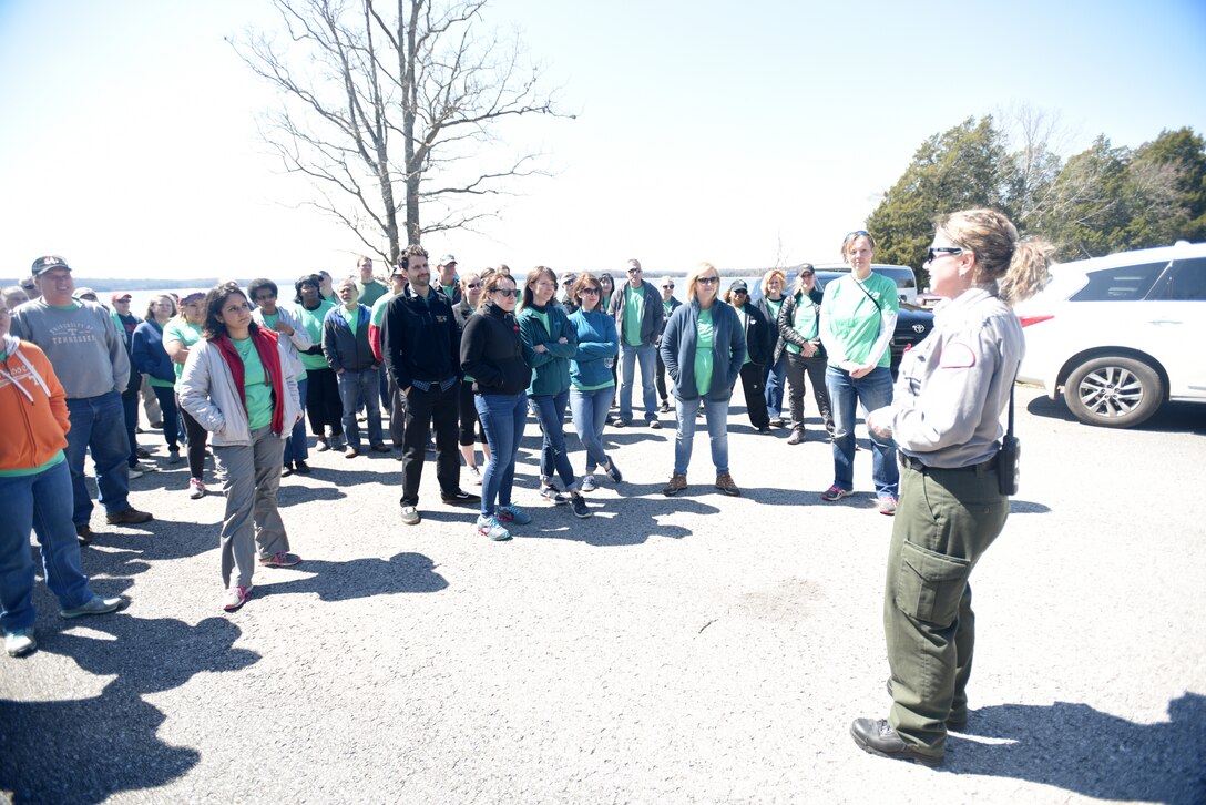 Park Ranger Amber Jones directs 60 volunteers from VF Solutions for an early Earth Day clean-up event March 22, 2018 at Seven Points Campground on the shoreline of J. Percy Priest Lake in Hermitage, Tenn. The VF Solutions employees partnered with the U.S. Army Corps of Engineers Nashville District to spruce up the popular campground ahead of the 2018 recreation season. (USACE photo by Lee Roberts)