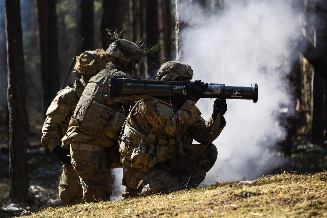 Soldiers fire an AT-4 rocket launcher.