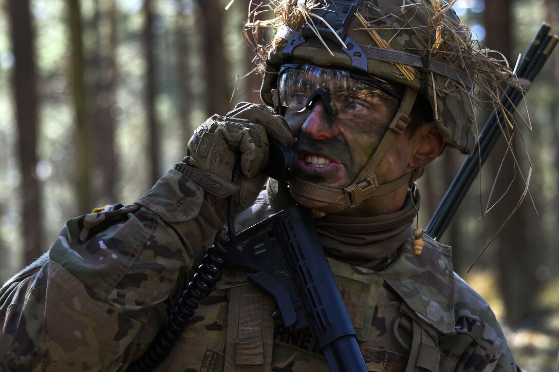 A soldier radios his headquarters leadership team.