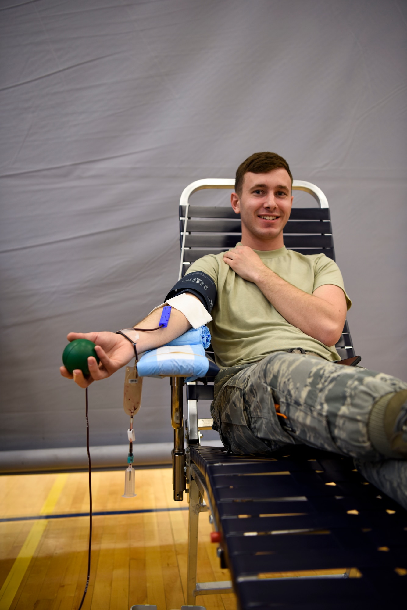 Airman 1st Class Anthony Gramazio, 436th Aerial Port Squadron, donates blood at the Armed Services Blood Program blood drive at the Dover Air Force Base Fitness Center March 19, 2018. The ASBP operates across the United States to provide quality blood products to all service members when needed. (U.S. Air Force Photo by Airman 1st Class Zoe M. Wockenfuss)