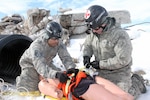 Airmen with the 42nd Chemical, Biological, Radiological, Nuclear Enhanced Response Fore-Package (CERF-P), Oregon National Guard, strap a mannequin to a litter after pulling it from the rubble pile and performing life-saving measures during joint exercise Vigilant Guard 2018 in Helena, Mont., March 6. Vigilant Guard is an exercise sponsored by U.S. Northern Command and National Guard Bureau, which is held in a different state each year.