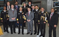 IMAGE: DAHLGREN, Va. (March 22, 2018) - Indian Navy Chief Adm. Sunil Lanba, center, and his delegation are pictured with Naval Surface Warfare Center Dahlgren Division (NSWCDD) leadership in front of the electromagnetic railgun prototype launcher. Lanba led the Indian delegation on an NSWCDD tour that included technical briefings on the U.S. Navy's Aegis Combat System, Directed Energy, and Electromagnetic Railgun Programs. They saw how the command integrates and develops complex warfare systems to incorporate electric weapons technology into existing and future fighting forces and platforms. Navy pilots from Naval Air Warfare Center Aircraft Division also briefed India's top admiral as he flew aboard an MH-60R Seahawk for a demonstration of the helicopter's capabilities. The MH-60R Seahawk missions are anti-submarine warfare, anti-surface warfare, surveillance, communications relay, combat search and rescue, naval gunfire support and logistics support. 

Lanba's NSWCDD visit came on the heels of his meeting with U.S. Chief of Naval Operations Adm. John Richardson at the Pentagon. The two heads of Navy met with U.S. Secretary of the Navy Richard Spencer on March 21 to discuss ways the two nations could improve interoperability that include additional naval exercises and staff talks. "The relationship between the U.S. Navy and the Indian Navy has never been stronger," said Richardson. "There has been meaningful progress made in strengthening the cooperation between our two great democratic and maritime nations. We are exploring every way to expand that partnership even further based on our shared interests."
