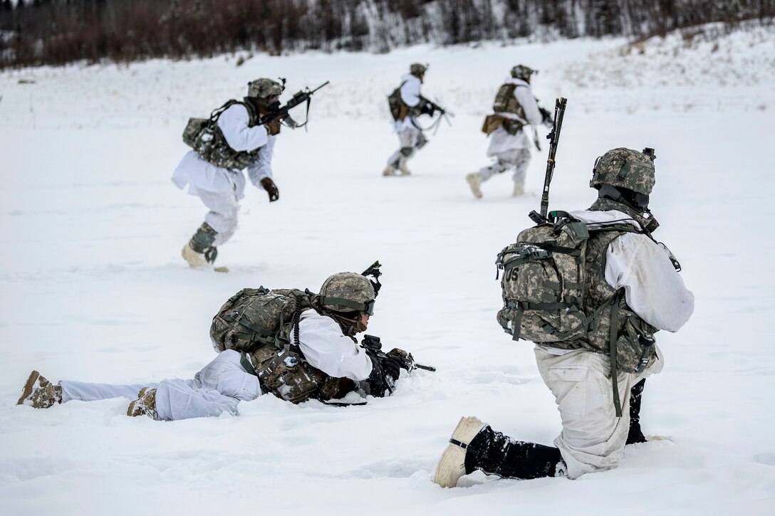 Soldiers create a security perimeter before engaging targets.