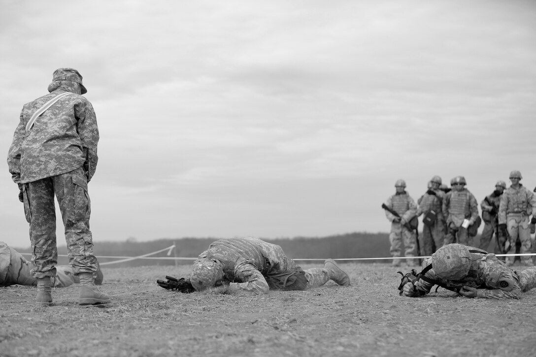 U.S. Army Reserve Soldiers, assigned to the 327th Quartermaster Battalion, based in Williamsport, Pennsylvania, conduct low crawling techniques in response to simulated direct fire, ahead of their lanes training validation, during Combat Support Training Exercise 78-18-03, at Fort Knox, Kentucky, Mar. 19, 2018.