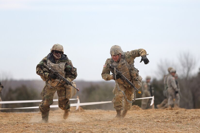 U.S. Army Reserve Soldiers, assigned to the 301st Maneuver Enhancement Brigade, conduct three-to-five second buddy rushes as part of their reacting to direct fire training, ahead of their lanes training validation, during Combat Support Training Exercise 78-18-03, at Fort Knox, Kentucky, Mar. 19, 2018.