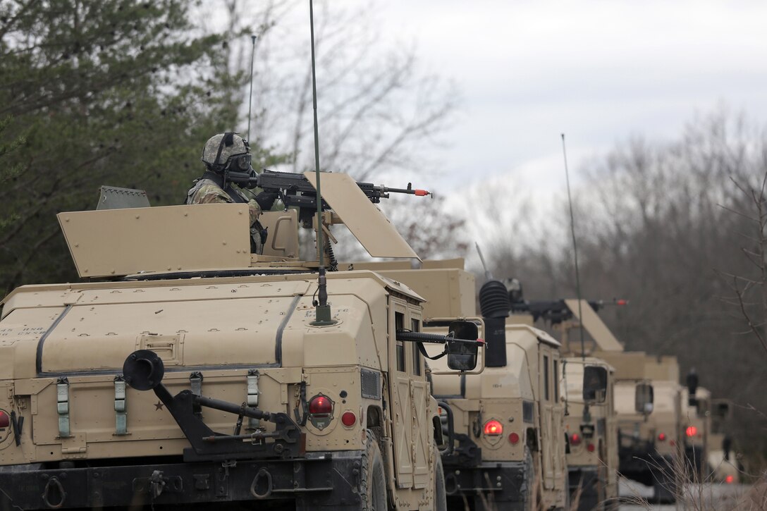 U.S. Army Reserve Soldiers, assigned to the 858th Movement Control Team, based in Bay City, Michigan, react to direct fire and a chemical or biological hazard/attack, ahead of their lanes training validation, during Combat Support Training Exercise 78-18-03, at Fort Knox, Kentucky, Mar. 19, 2018.