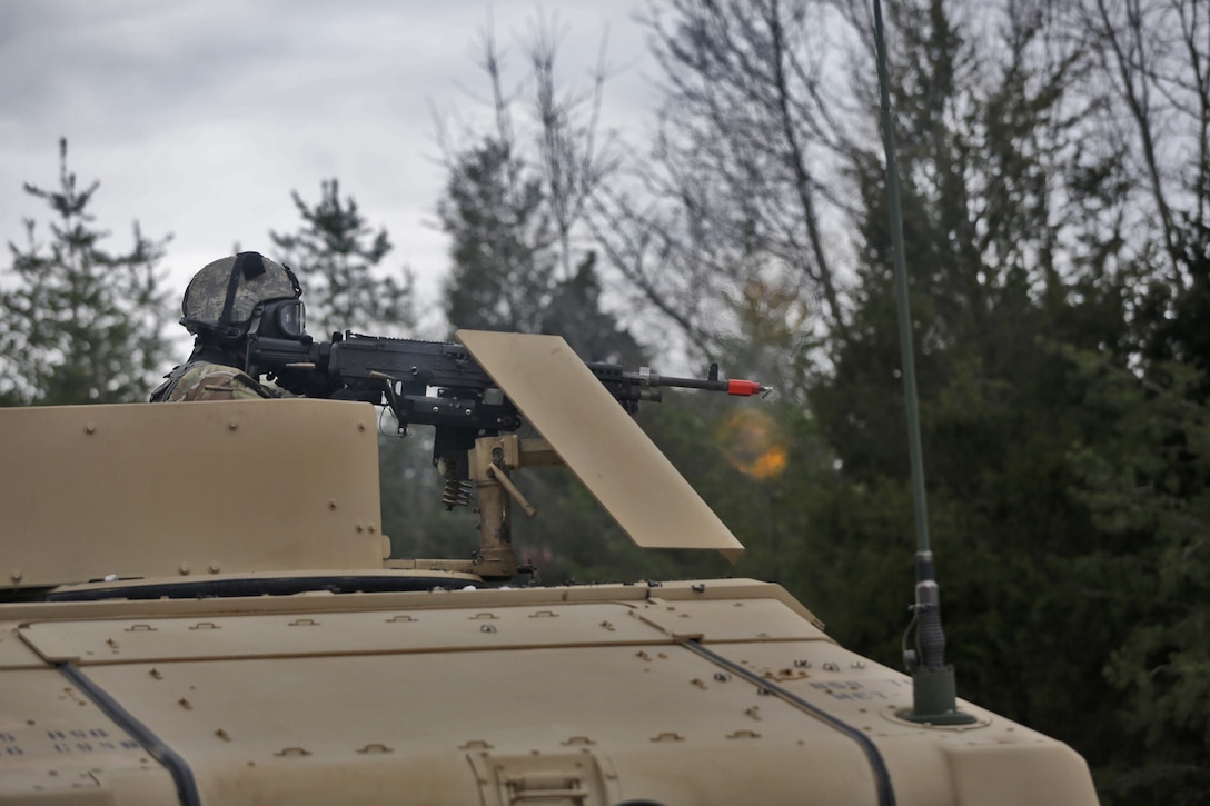 A U.S. Army Reserve Soldier, assigned to the 858th Movement Control Team, based in Bay City, Michigan, reacts to direct fire while wearing protective gear in light of a potential chemical or biological hazard attack, ahead of their lanes training validation, during Combat Support Training Exercise 78-18-03, at Fort Knox, Kentucky, Mar. 19, 2018.