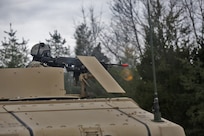A U.S. Army Reserve Soldier, assigned to the 858th Movement Control Team, based in Bay City, Michigan, reacts to direct fire while wearing protective gear in light of a potential chemical or biological hazard attack, ahead of their lanes training validation, during Combat Support Training Exercise 78-18-03, at Fort Knox, Kentucky, Mar. 19, 2018.