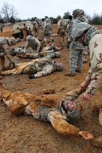 U.S. Army Reserve Soldiers, assigned to the 327th Quartermaster Battalion, based in Williamsport, Pennsylvania, conduct training on transporting a casualty as part of their skill level one tasks, ahead of their lanes training validation, during Combat Support Training Exercise 78-18-03, at Fort Knox, Kentucky, Mar. 20, 2018.